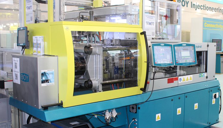 Two Injection Moulding Machines at Plast Milan: a Small Giant and a Big Dwarf.